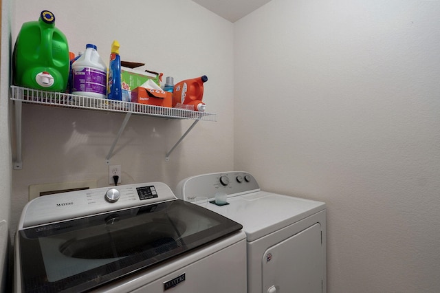 washroom featuring laundry area and washing machine and dryer