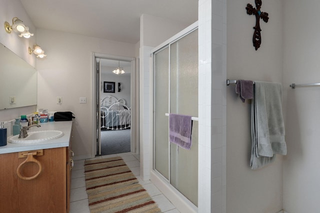 full bathroom featuring connected bathroom, vanity, a shower stall, and tile patterned flooring