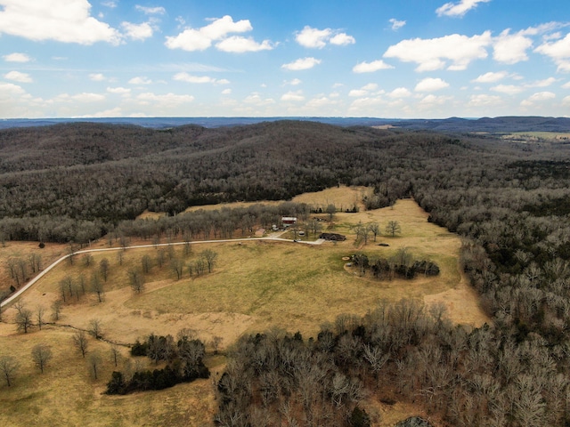 drone / aerial view featuring a view of trees