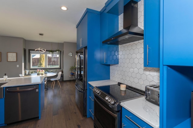 kitchen featuring decorative backsplash, range with electric stovetop, dishwasher, wall chimney range hood, and blue cabinets