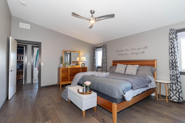 bedroom featuring ceiling fan, visible vents, lofted ceiling, and wood finished floors