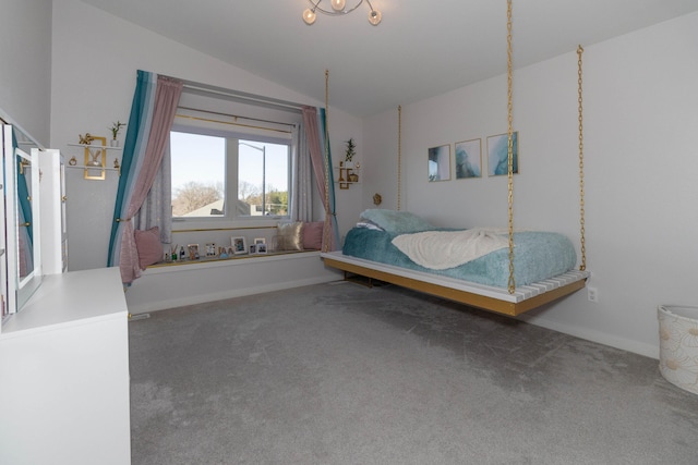 carpeted bedroom featuring baseboards and vaulted ceiling