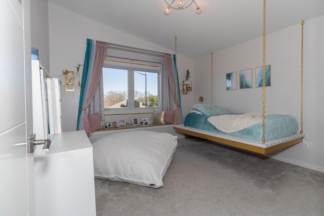 carpeted bedroom with lofted ceiling