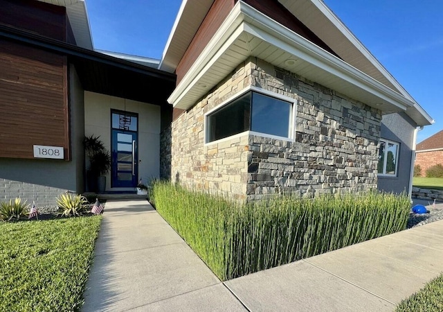 view of side of home featuring stone siding