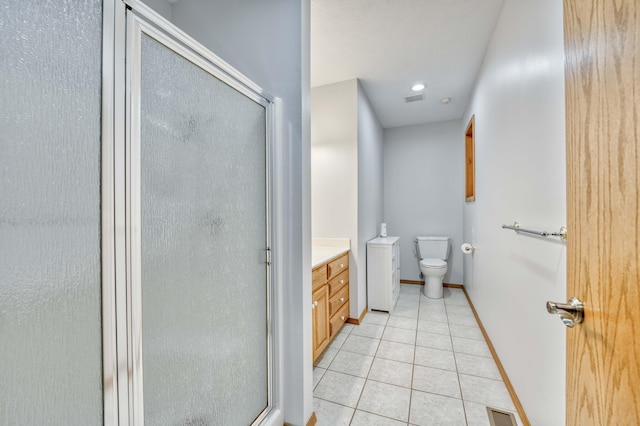 full bath featuring tile patterned flooring, toilet, a stall shower, and vanity