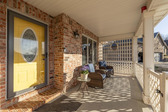 view of patio featuring a porch