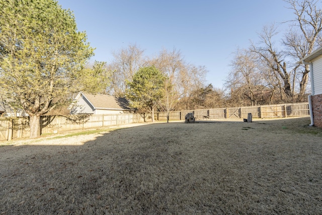 view of yard with a fenced backyard