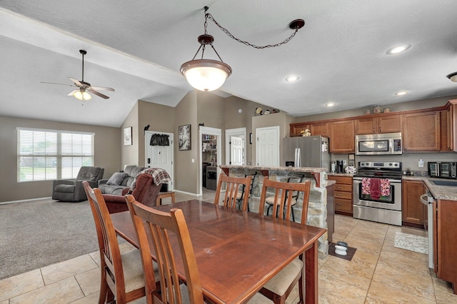 dining area featuring recessed lighting, baseboards, light colored carpet, ceiling fan, and vaulted ceiling