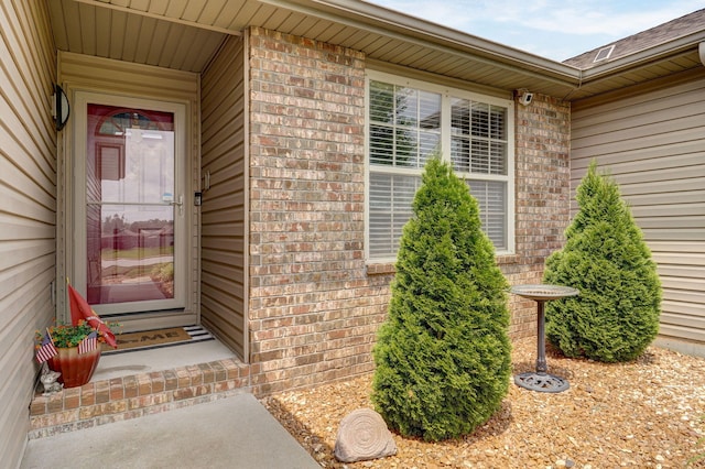 property entrance with brick siding