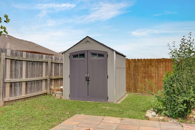 view of shed with a fenced backyard