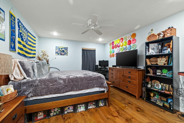 bedroom with wood finished floors and ceiling fan