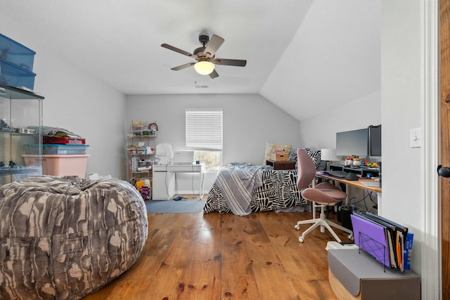 bedroom featuring ceiling fan, lofted ceiling, and hardwood / wood-style floors