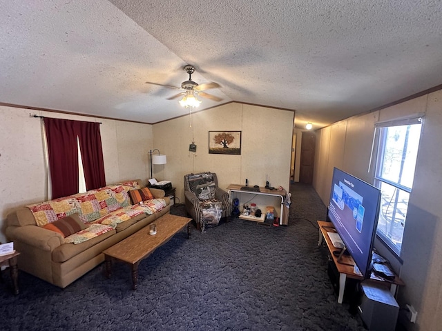 living room featuring carpet, ornamental molding, vaulted ceiling, a textured ceiling, and a ceiling fan