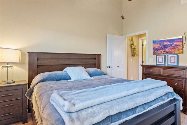 bedroom featuring a high ceiling
