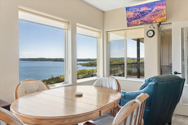 dining room featuring a water view
