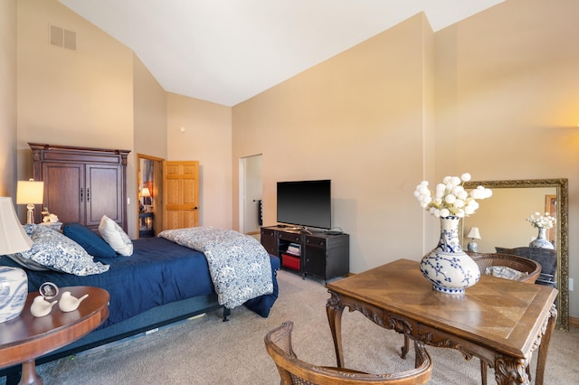 bedroom with light carpet, visible vents, and high vaulted ceiling