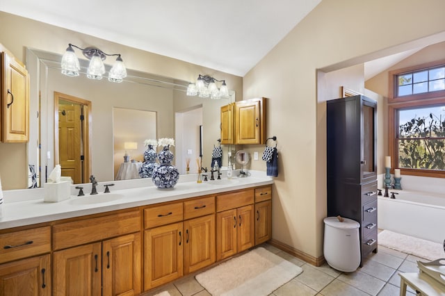 bathroom with a sink, lofted ceiling, double vanity, and tile patterned flooring