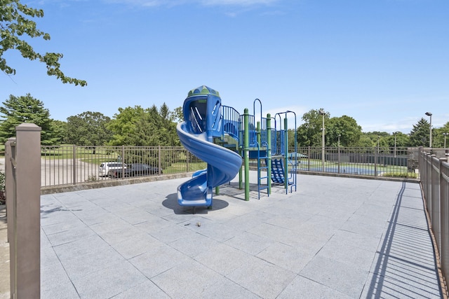 communal playground featuring fence