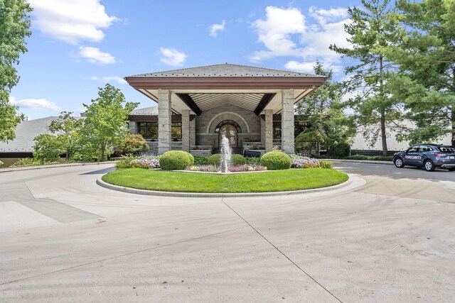 view of community featuring concrete driveway