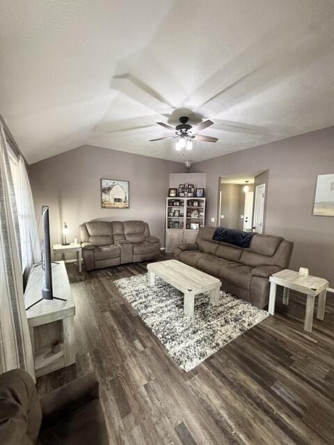 living area featuring dark wood-style floors, ceiling fan, and lofted ceiling