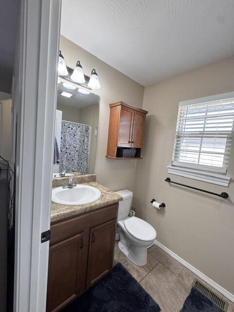 full bathroom with tile patterned flooring, visible vents, baseboards, toilet, and vanity