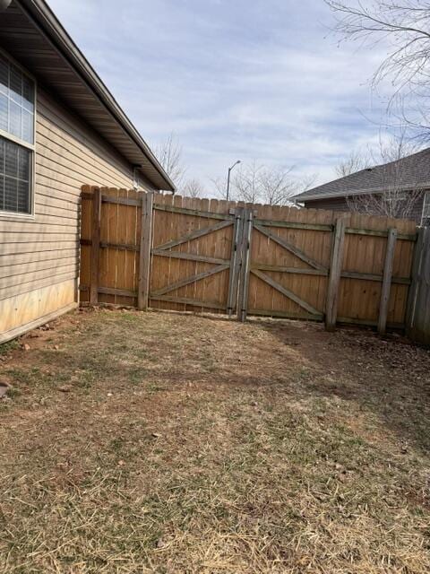 view of yard featuring a gate and fence