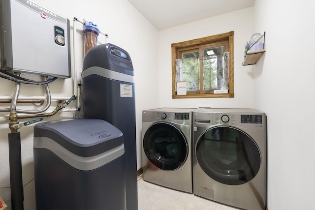 laundry room featuring washer and clothes dryer and laundry area