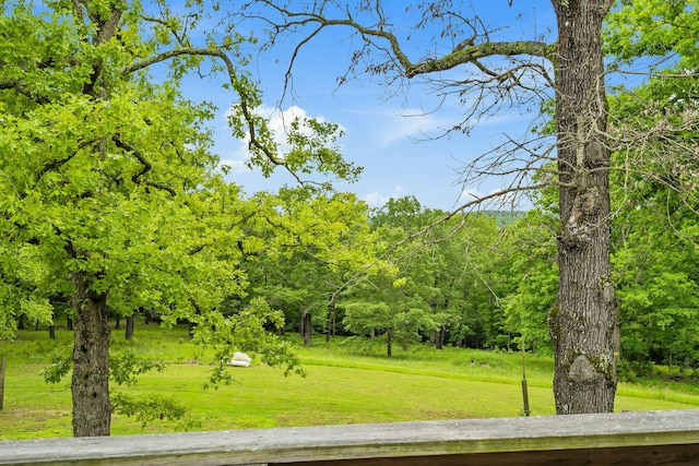 view of property's community featuring a yard