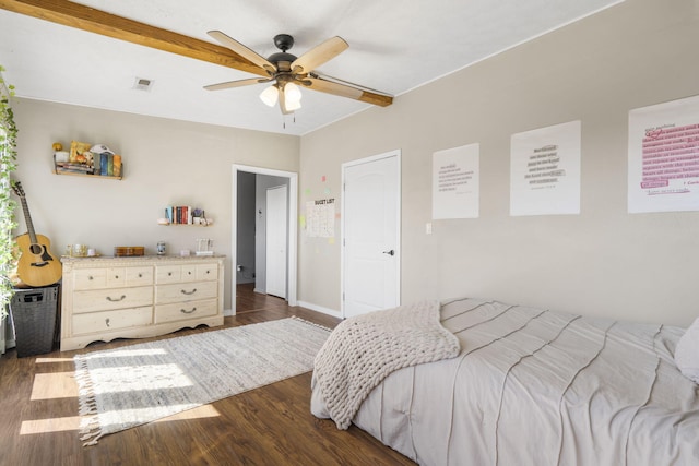 bedroom featuring beamed ceiling, visible vents, dark wood-style flooring, and ceiling fan