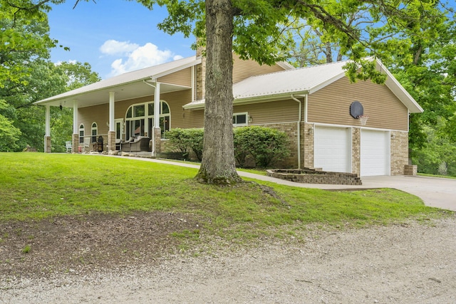 view of front of house featuring brick siding, a front lawn, a porch, concrete driveway, and an attached garage