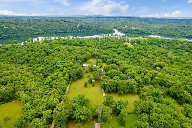 bird's eye view with a forest view and a water view