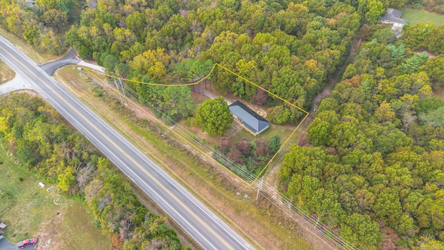 aerial view featuring a wooded view