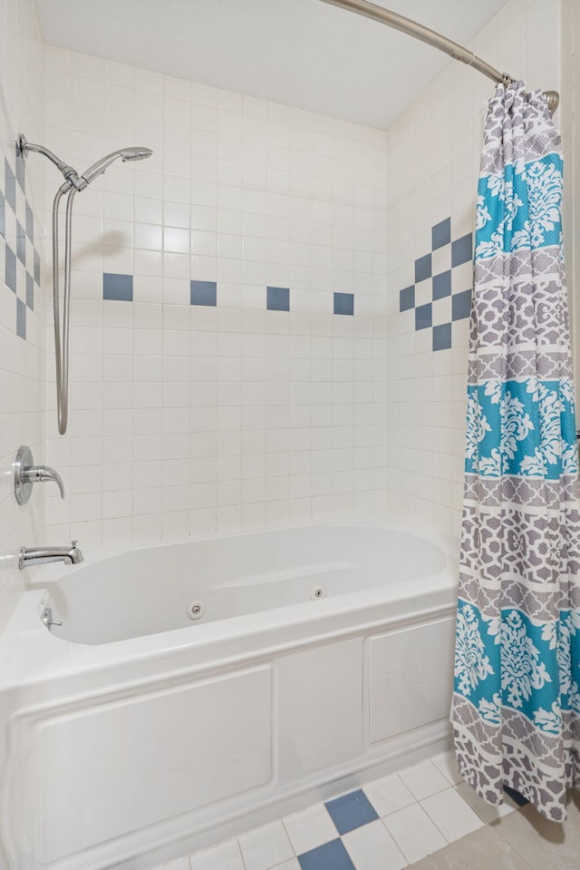 bathroom featuring tile patterned floors and a combined bath / shower with jetted tub