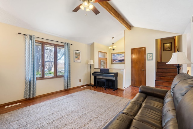 living area with vaulted ceiling with beams, baseboards, stairway, wood finished floors, and a ceiling fan