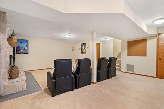 home theater room featuring visible vents, baseboards, and carpet