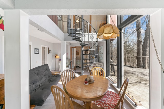 dining space with stairway and visible vents