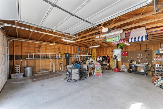 garage featuring a workshop area and a garage door opener