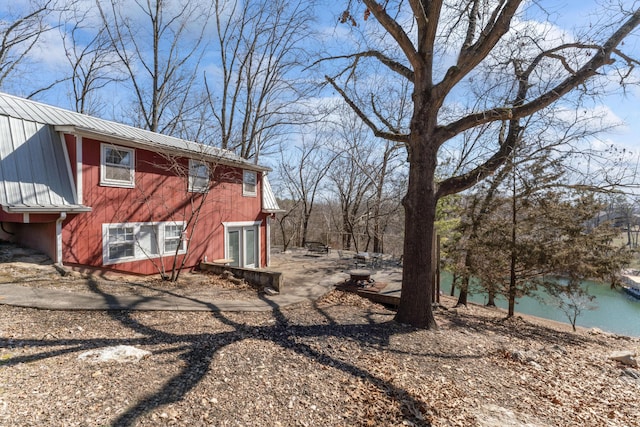 view of side of property with metal roof