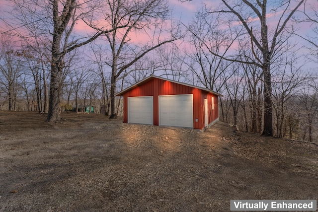 garage at dusk with a garage