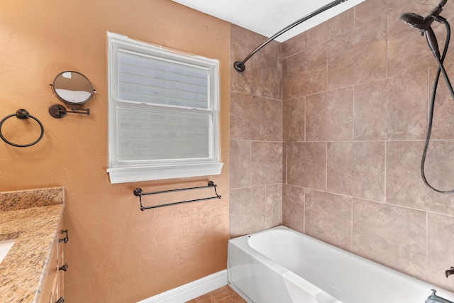 bathroom featuring baseboards and vanity