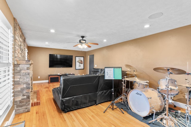 recreation room with recessed lighting, wood finished floors, baseboards, and ceiling fan