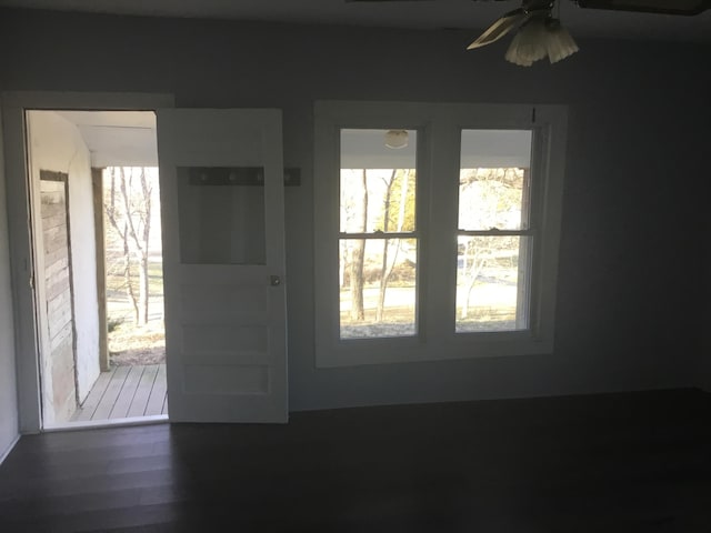 foyer entrance featuring wood finished floors and a ceiling fan