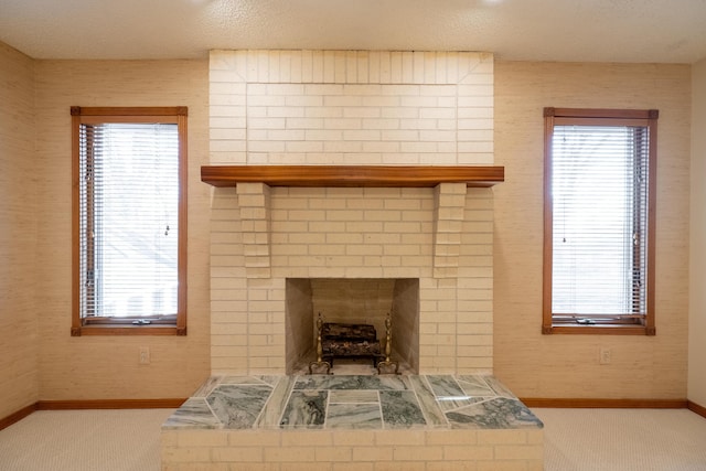 details featuring a brick fireplace, carpet flooring, and baseboards