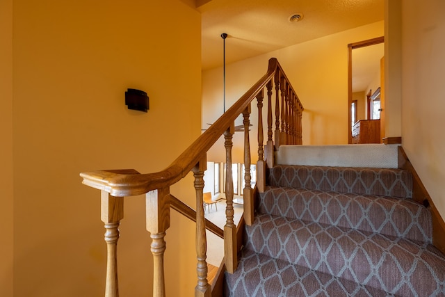 stairs featuring visible vents and a healthy amount of sunlight