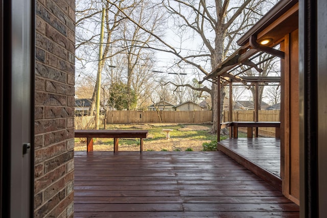 deck with a fenced backyard