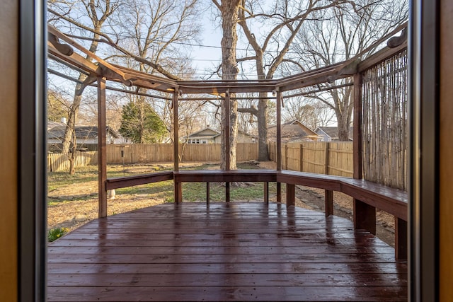 deck with a fenced backyard