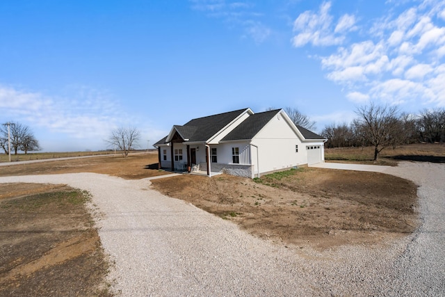 view of front facade with stucco siding, an attached garage, and concrete driveway