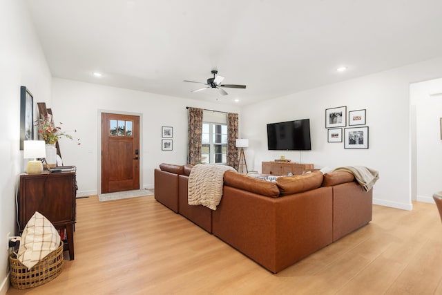 living room featuring a ceiling fan, light wood-style flooring, recessed lighting, and baseboards