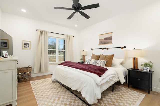 bedroom with recessed lighting, light wood-type flooring, baseboards, and ceiling fan