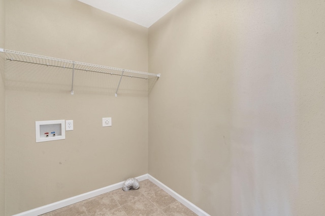 laundry area with electric dryer hookup, baseboards, hookup for a washing machine, and laundry area